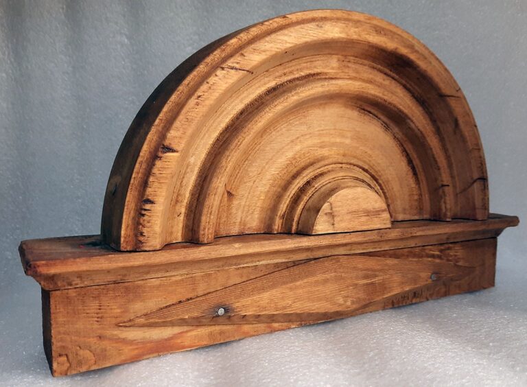 Laser cleaned wooden ornament